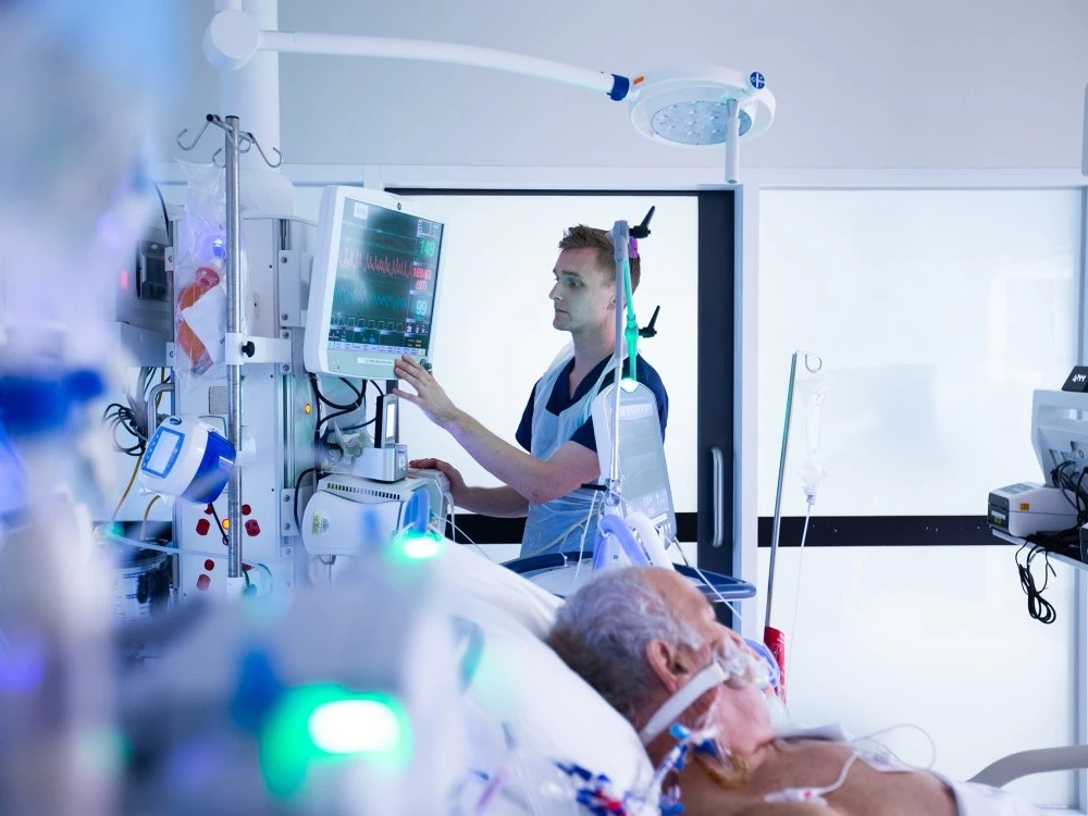 ICU nurse caring for a seriously unwell patient